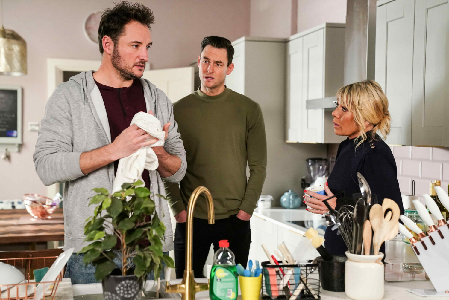 Zack and Sharon looks serious as they talk to Martin in EastEnders