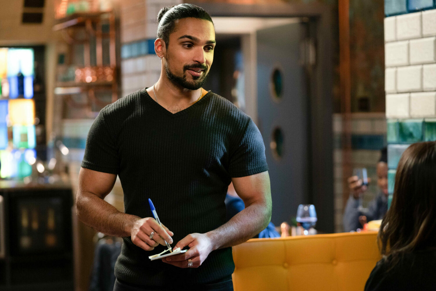 EastEnders: Ravi smiles as he take Denise's order.