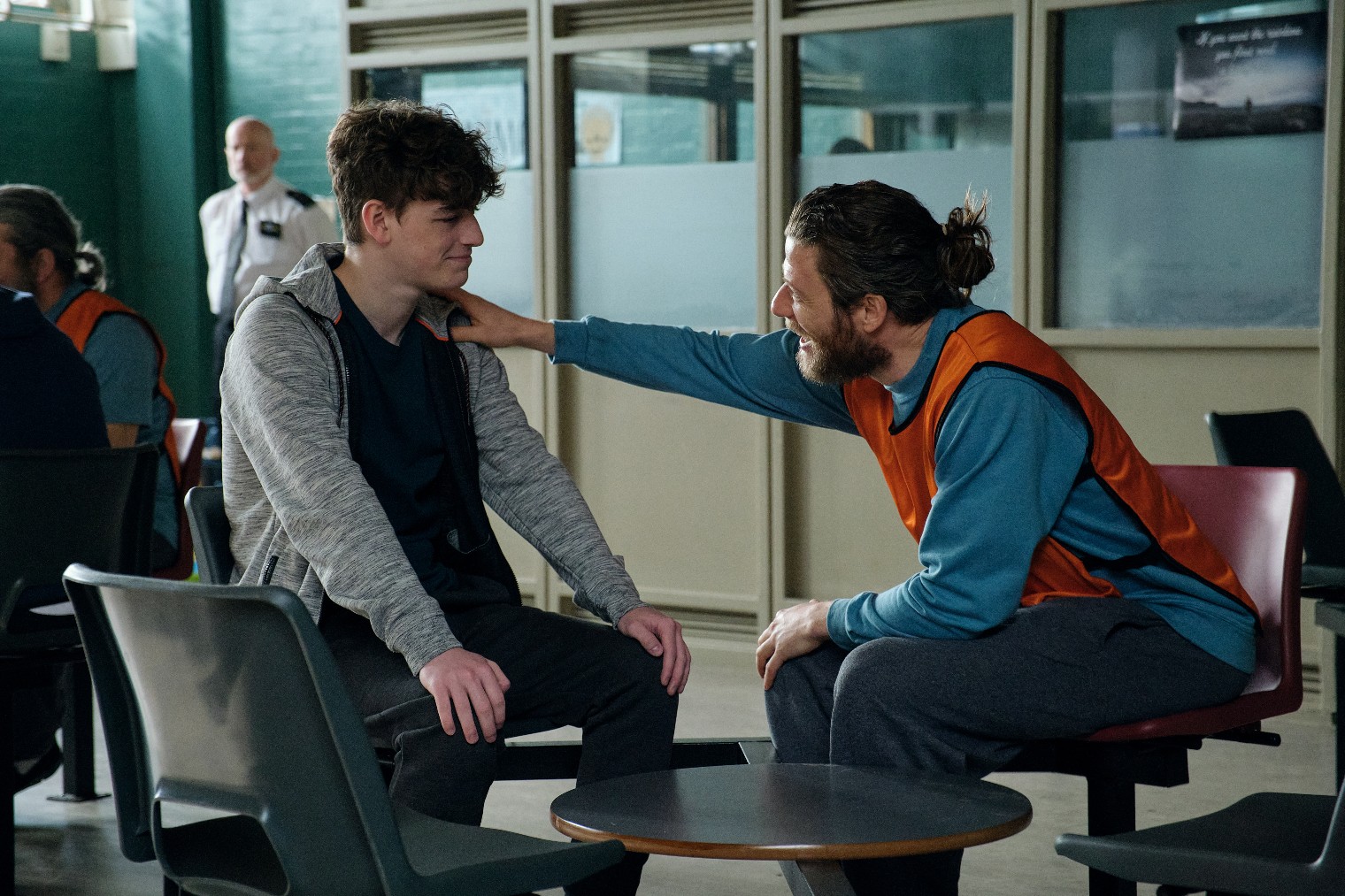 Tommy puts his hand on Ryan's shoulder in Happy Valley