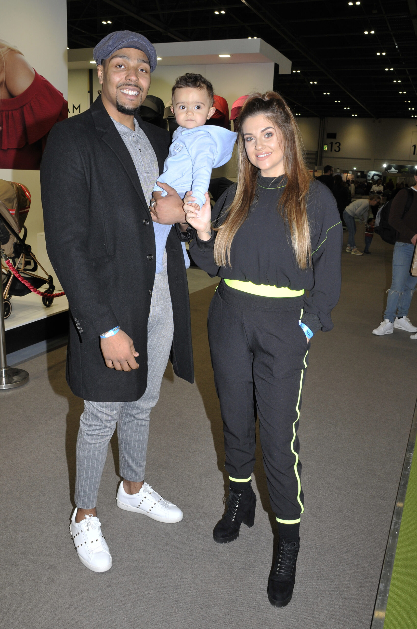 Jordan Banjo posing with his wife and son