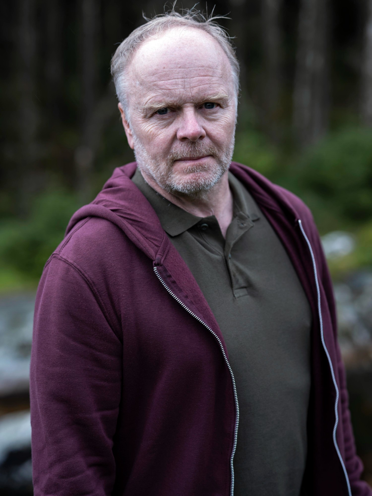 Jason Watkins wearing a maroon jacket in The Catch