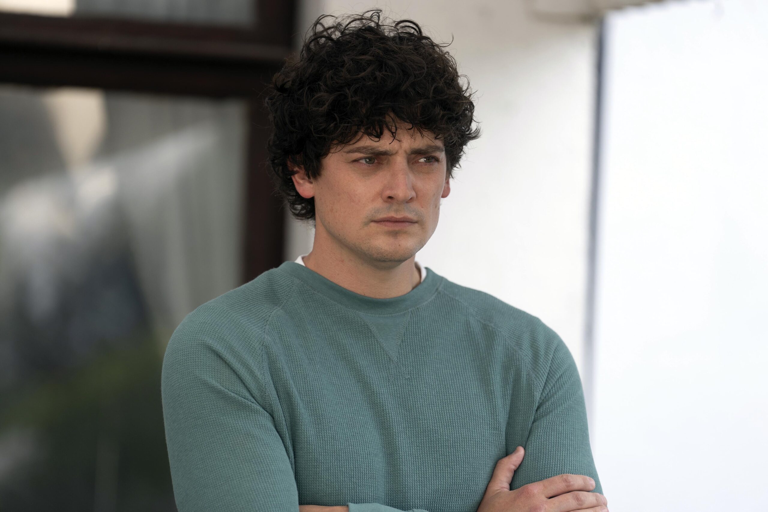Aneurin Barnard wearing a blue jumper in The Catch