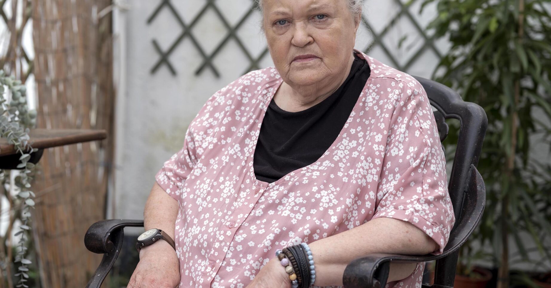 Brenda Fricker posing in a chair in the garden in The Catch