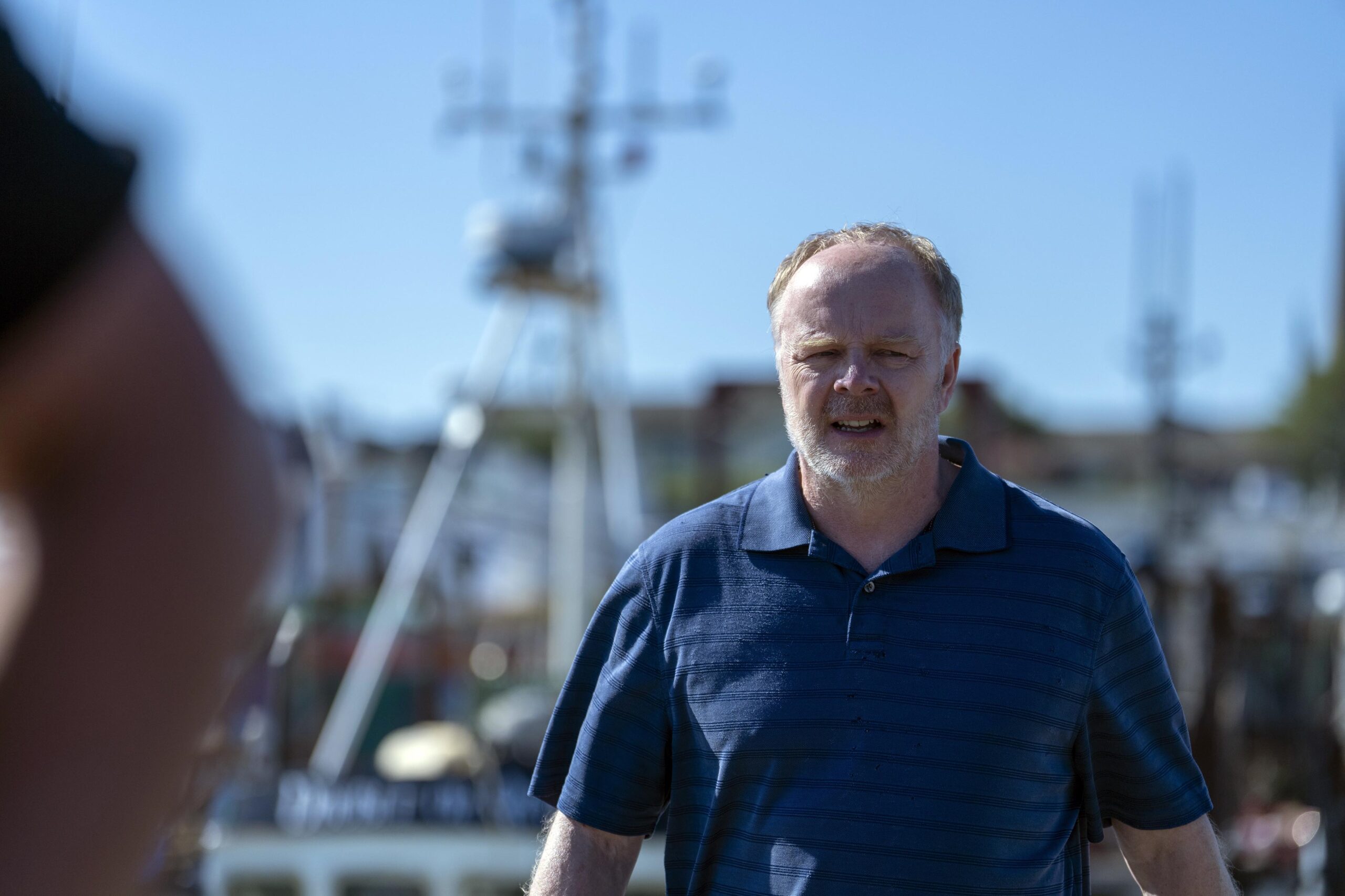 Ed looking worried at the harbour in The Catch