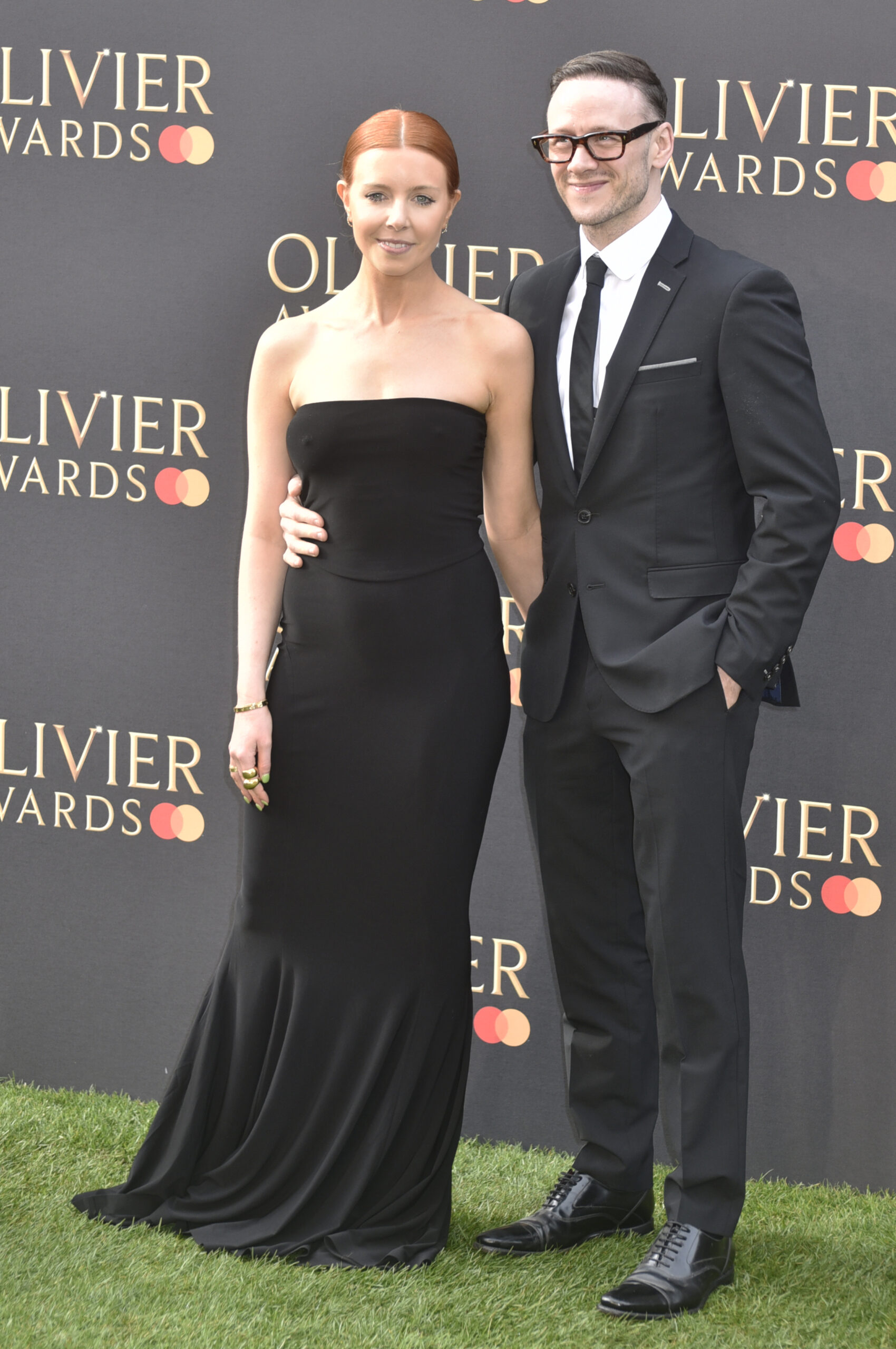 Stacey Dooley and Kevin Clifton smiling on the red carpet