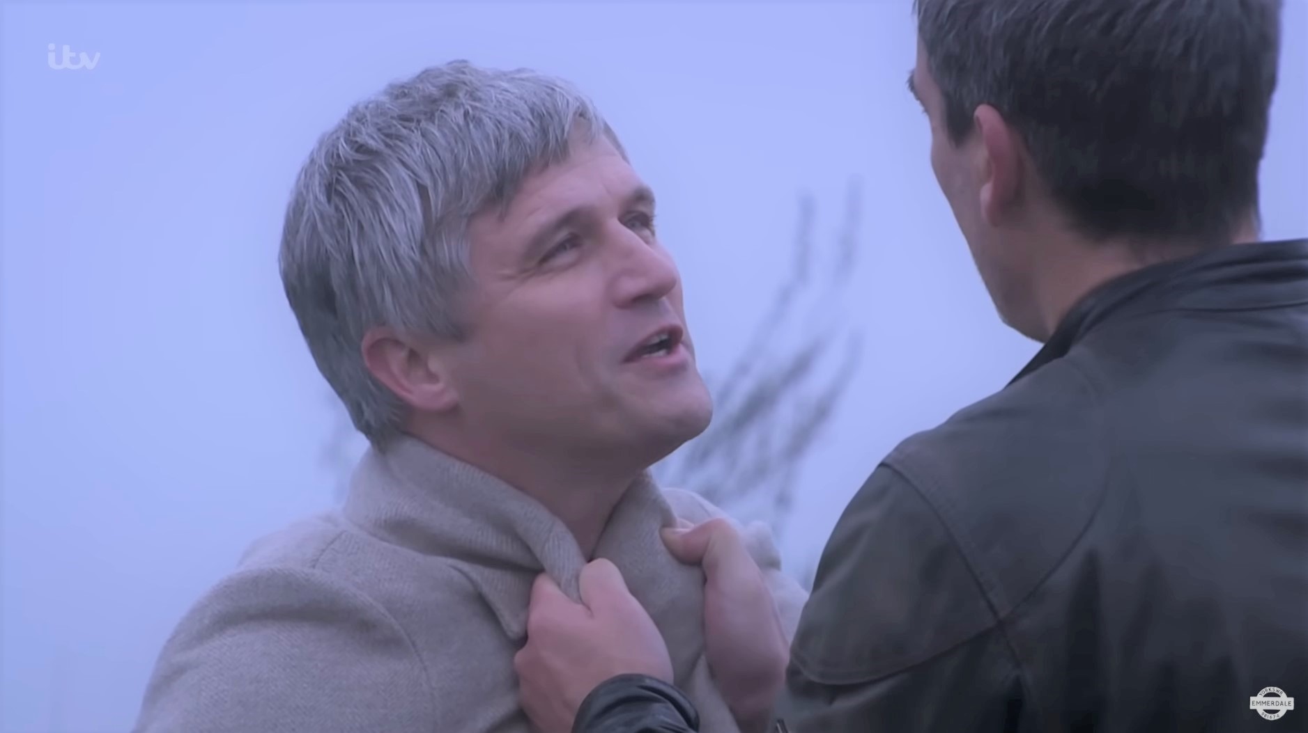 Emmerdale: Caleb is threatened by Cain who grabs his coat lapels