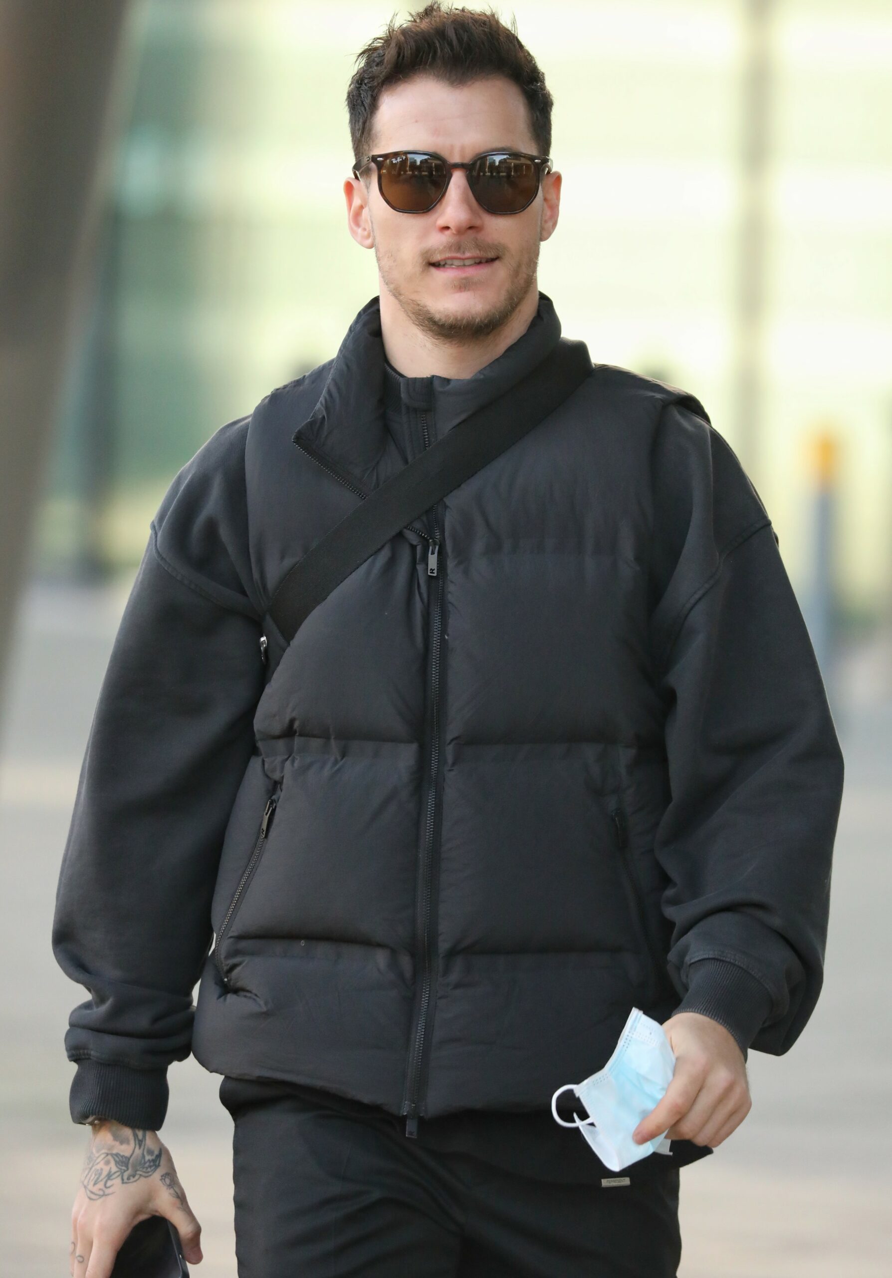 Strictly star Gorka Marquez wearing sunglasses and coat 