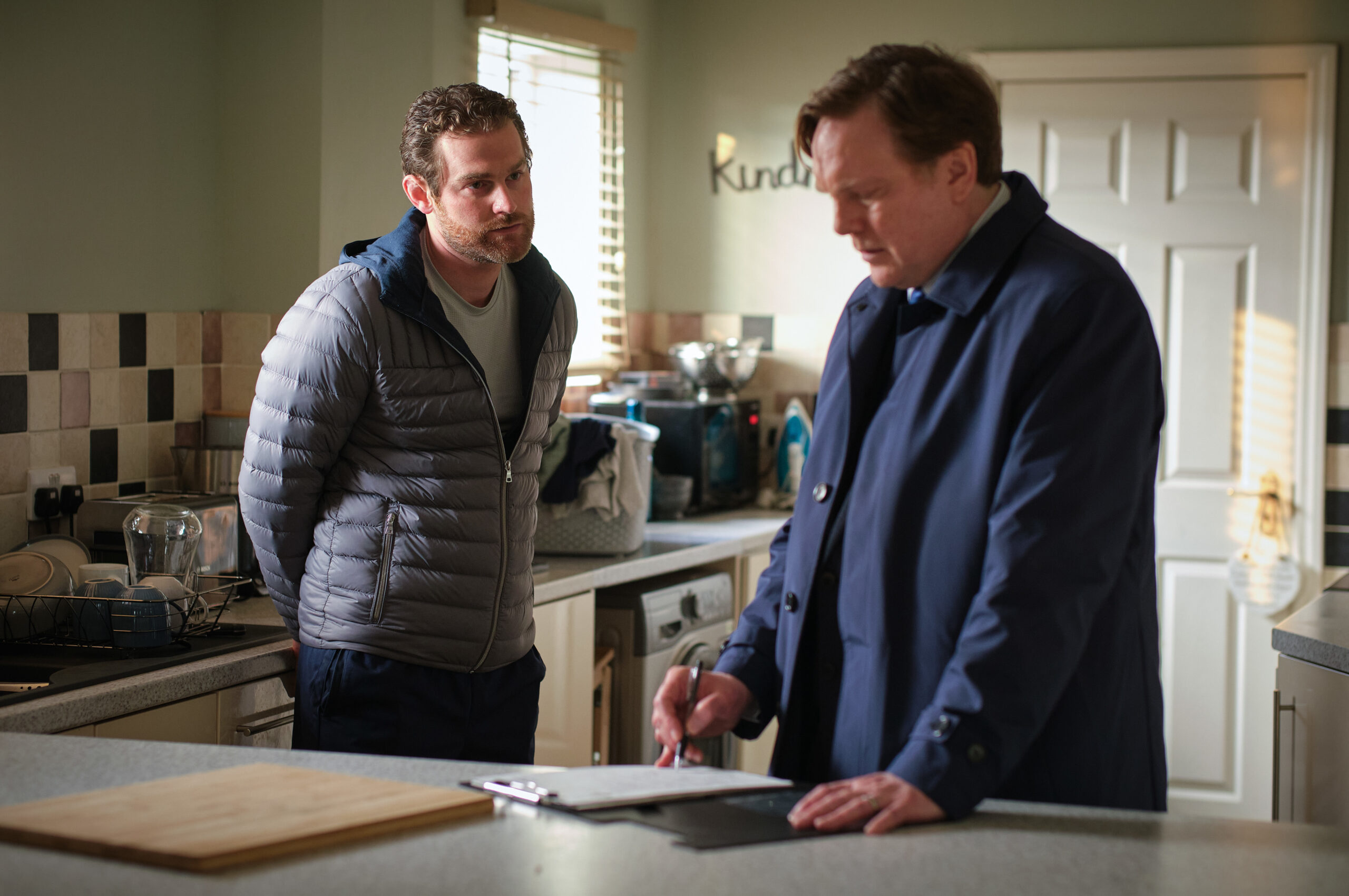 Andrew Tiernan and Mark Stanley talking in the kitchen in Happy Valley