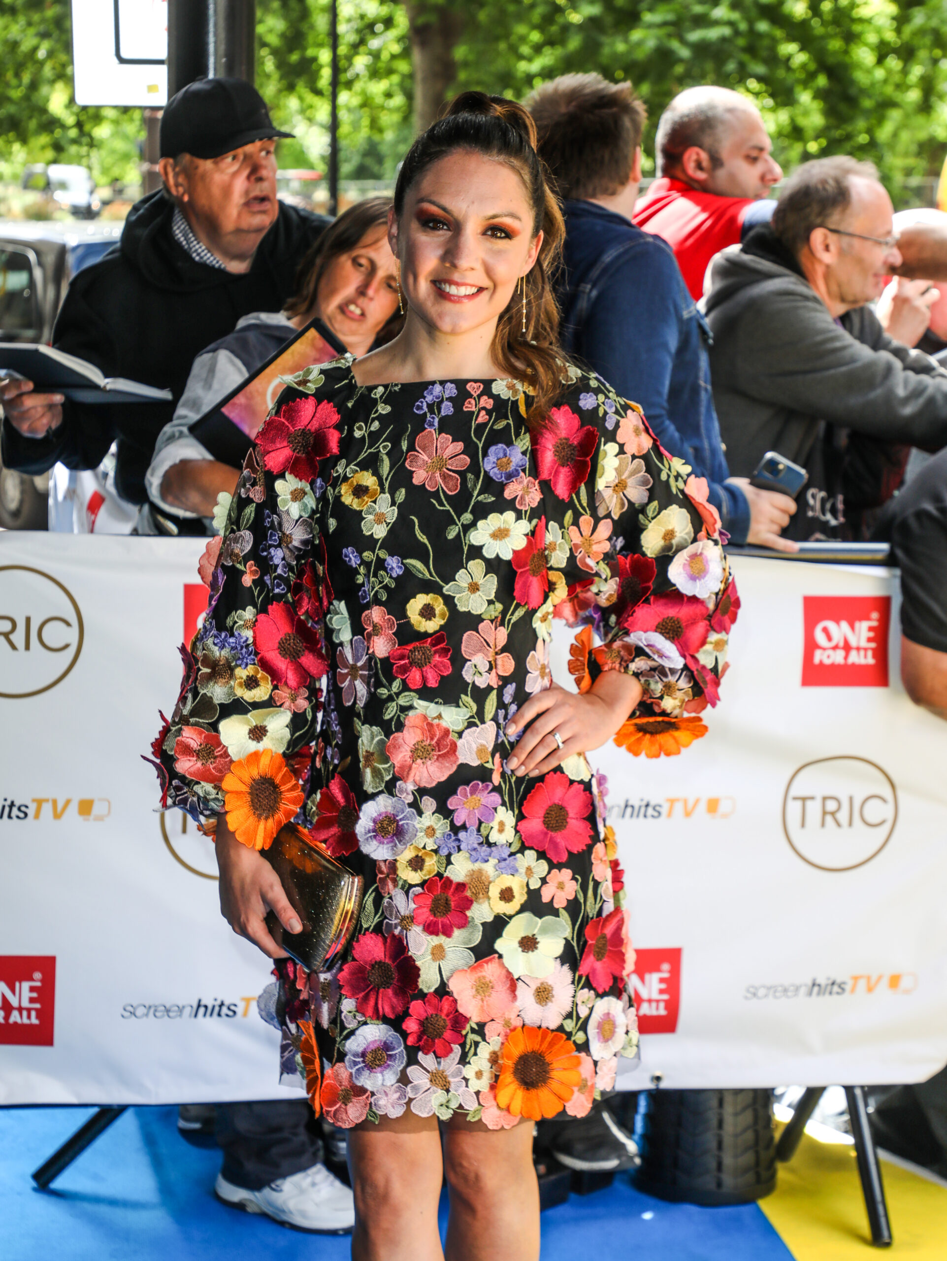 Laura Tobin at TRIC Awards in a floral dress