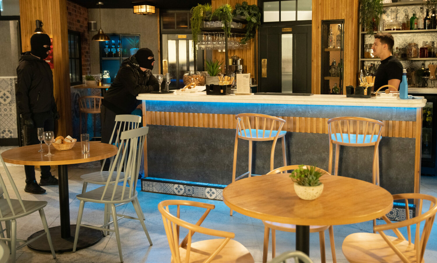 Masked gunmen enter the Bistro in Coronation Street and threaten Ryan