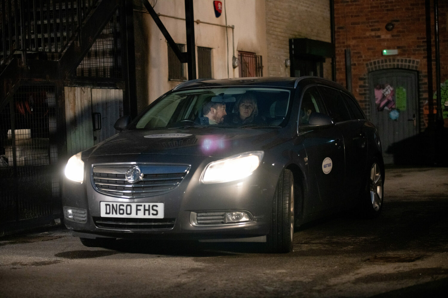 Eileen and Todd sit with Mitch in the taxi in Coronation Street