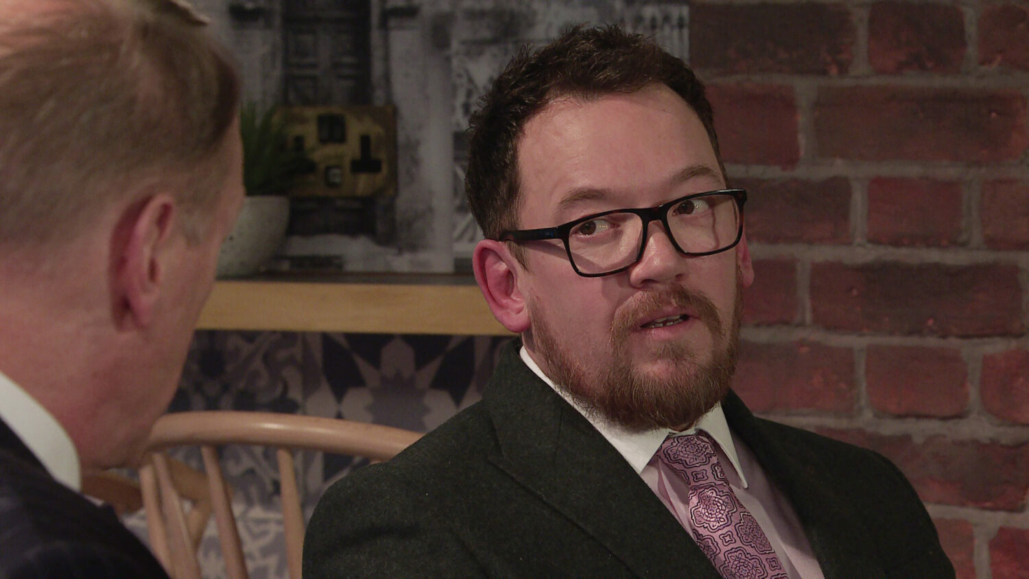 Rufus in Coronation Street looks at Stephen suspiciously