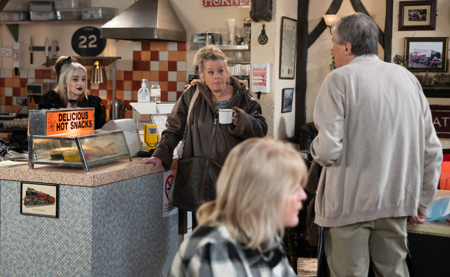 Coronation Street's Nina and Bernie are talking to Roy in the café 