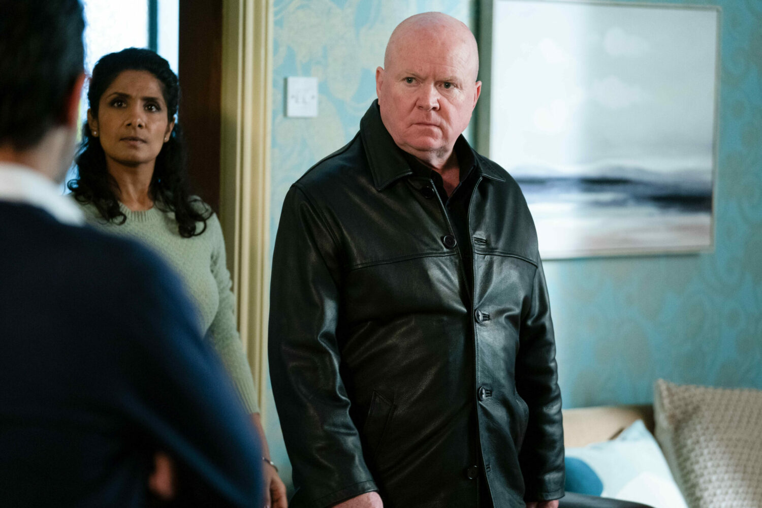EastEnders: Phil Mitchell looks angry as he squares up to Nish with Suki in the background