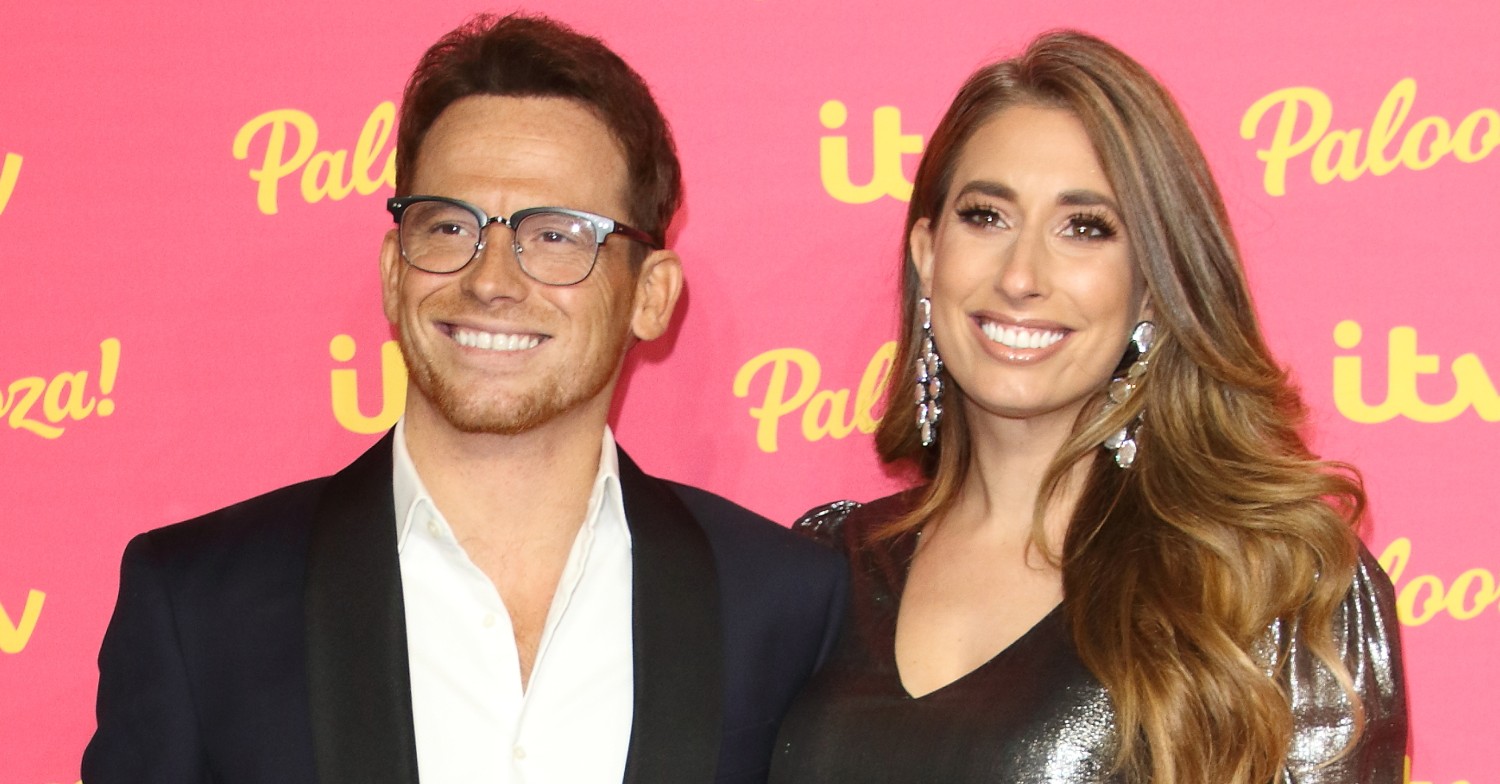 Stacey Solomon and Joe Swash smiling at an event