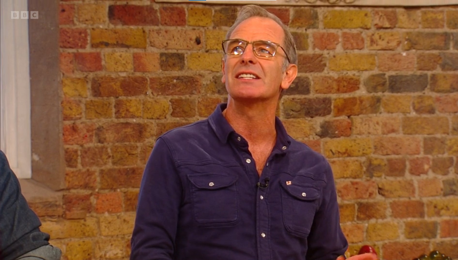 Robson Green looks up to the sky as he talks 