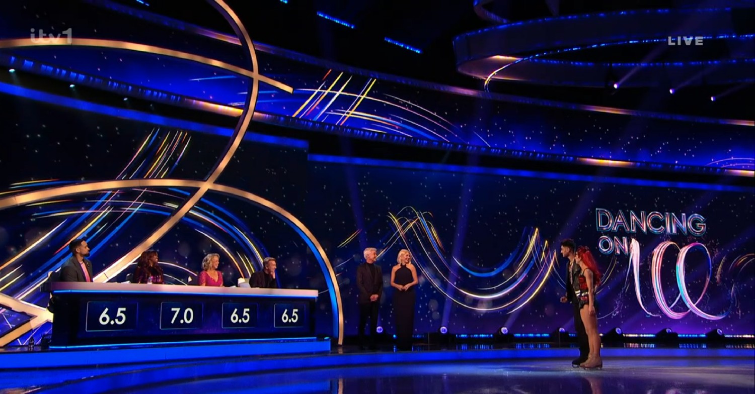 Dancing On Ice tonight judges giving feedback to a couple as Holly and Phillip watch on