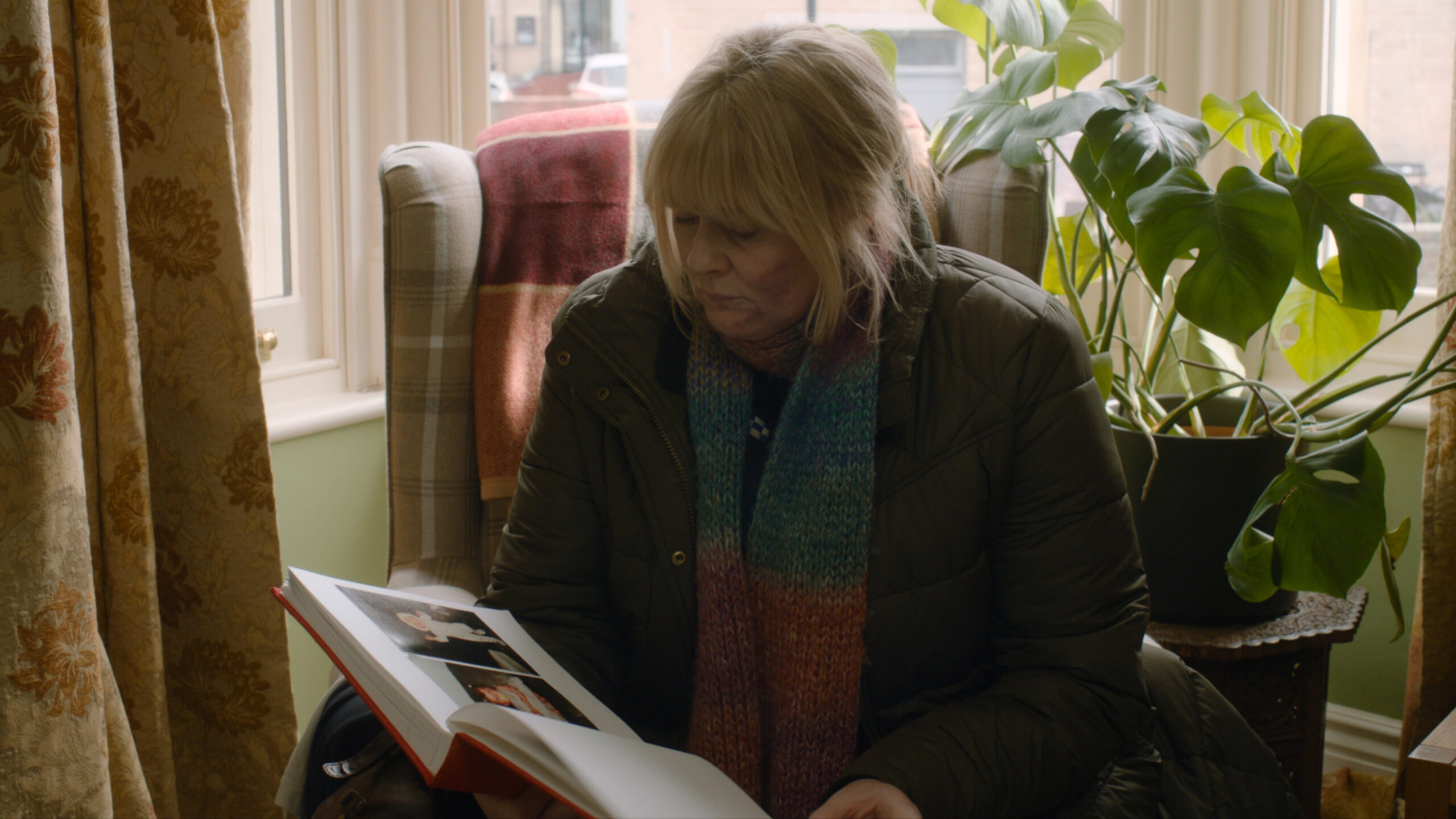Catherine Cawood looks at baby pictures of Ryan in Happy Valley series 3 episode 6