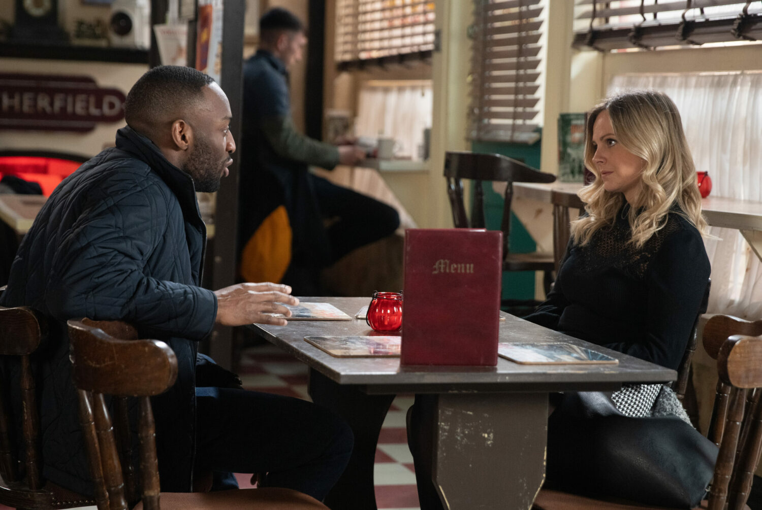 Michael and Sarah in Coronation Street have a serious talk in the cafe