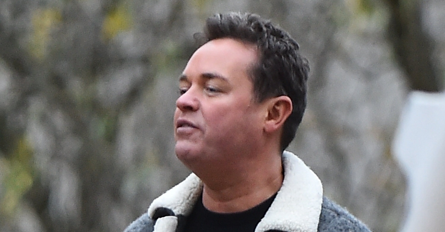Stephen Mulhern with a sombre expression as he stands outside