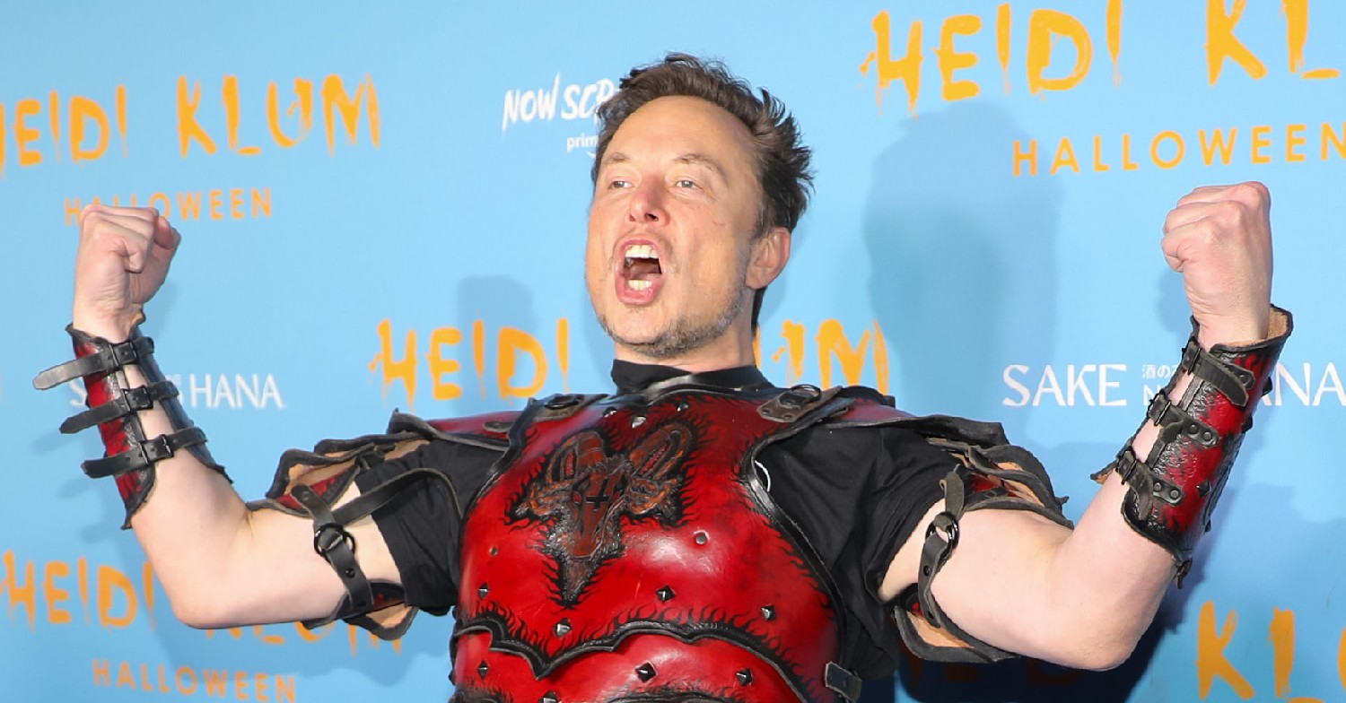 Elon Musk giving a battle cry in some armour 