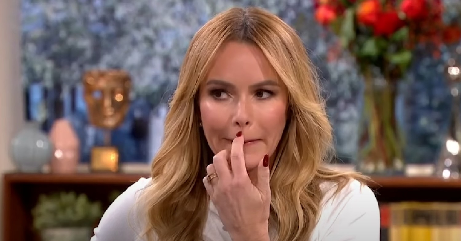 Amanda Holden scratches her cupid's bow on This Morning