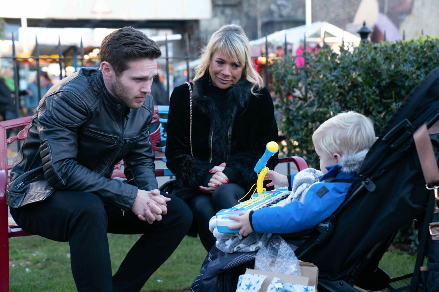 Keanu and Sharon look fondly at baby Albie on EastEnders