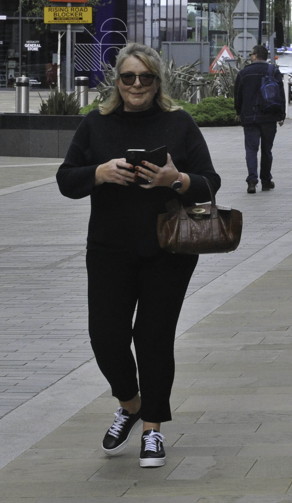 Fern Britton wearing sunglasses in the street