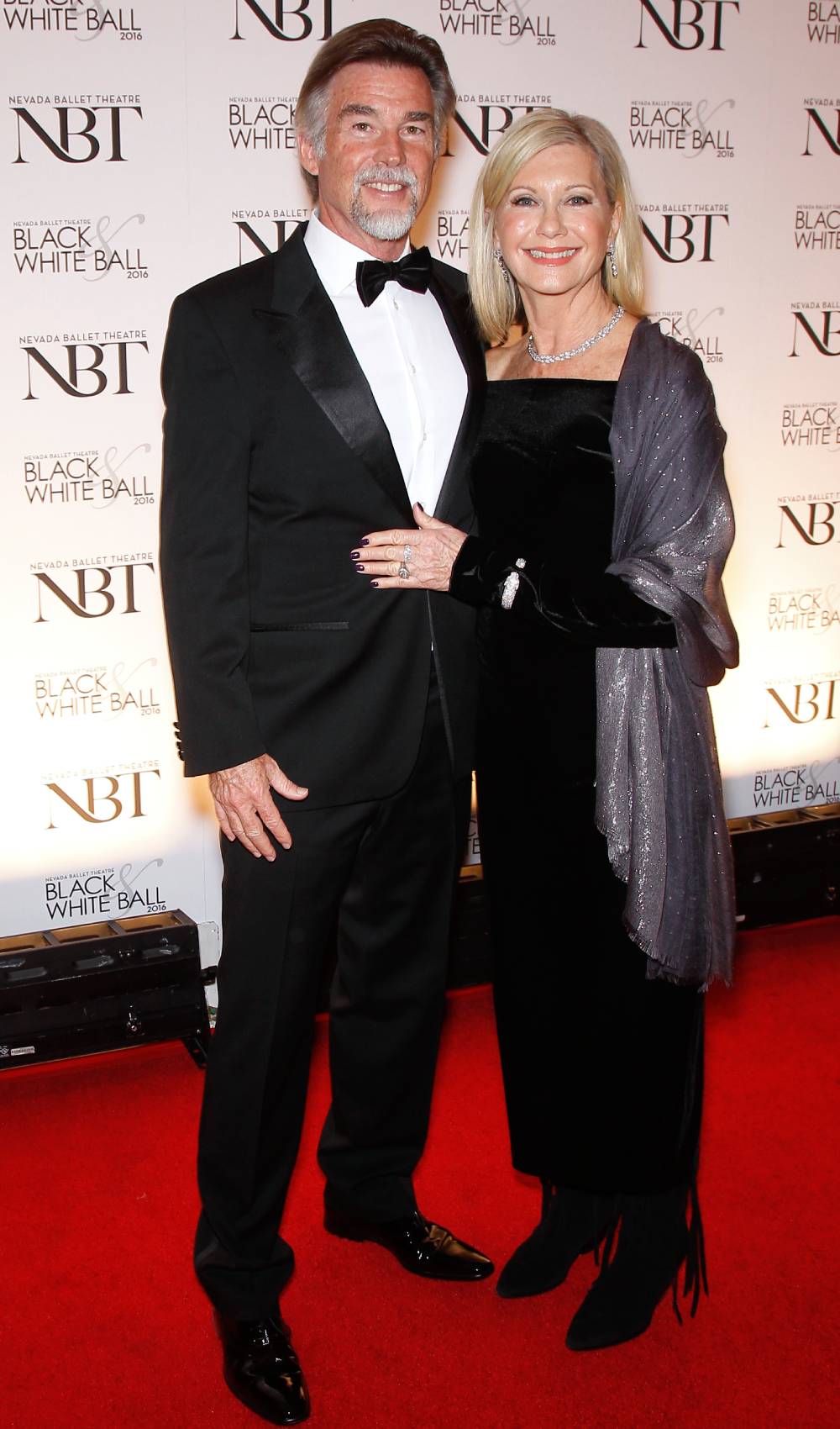 Olivia Newton-John and her husband John Easterling smile for cameras