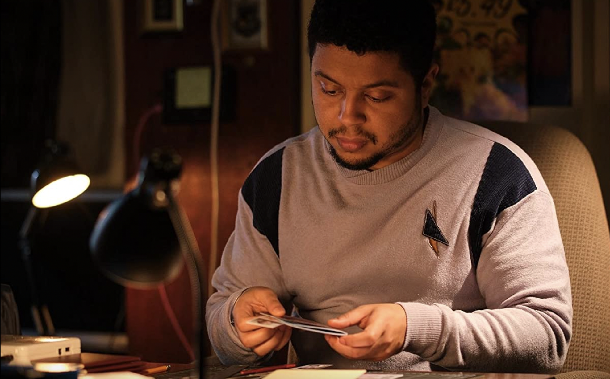 Zak Douglas looks through photosin Ridley