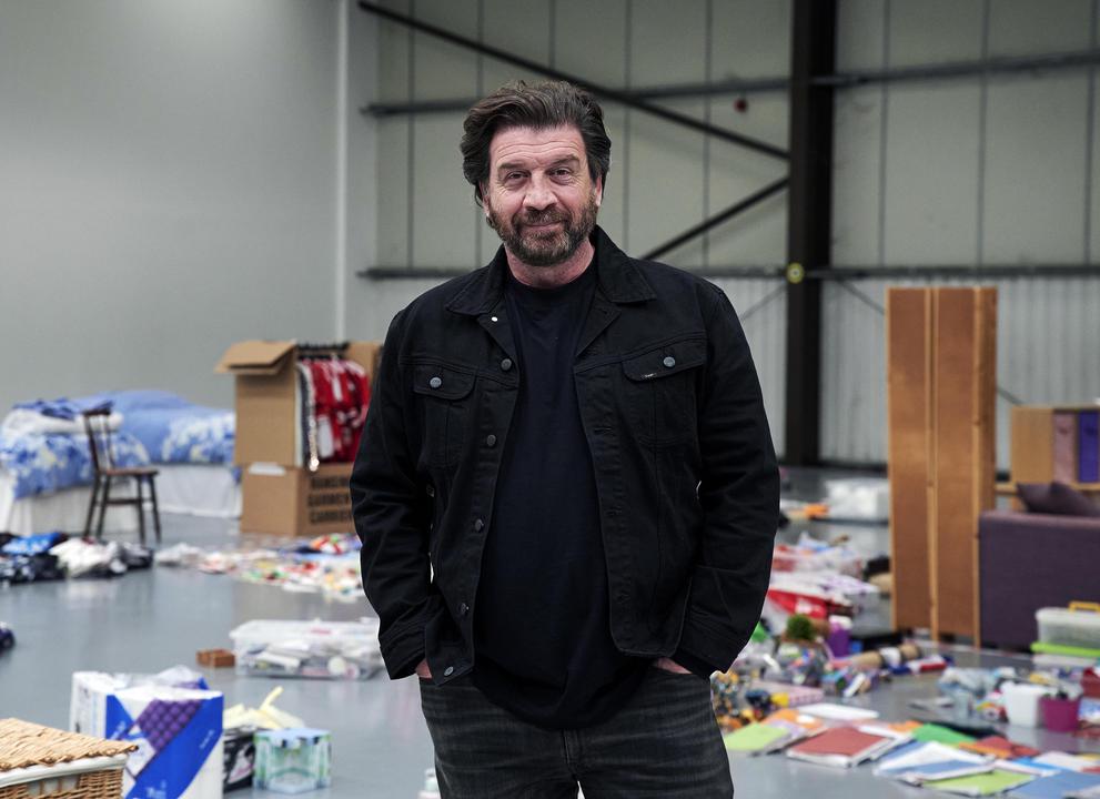 Nick Knowles stands in a hall for Big House Clearout