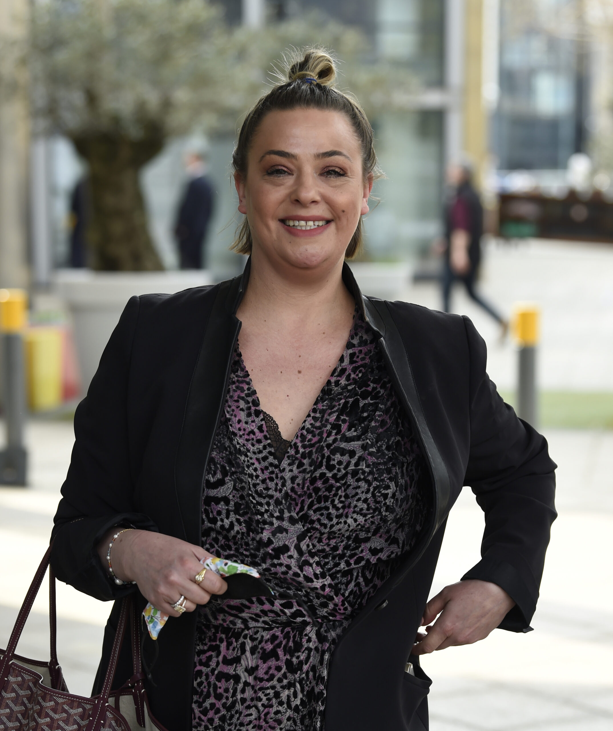 Lisa Armstrong smiling with her hair up