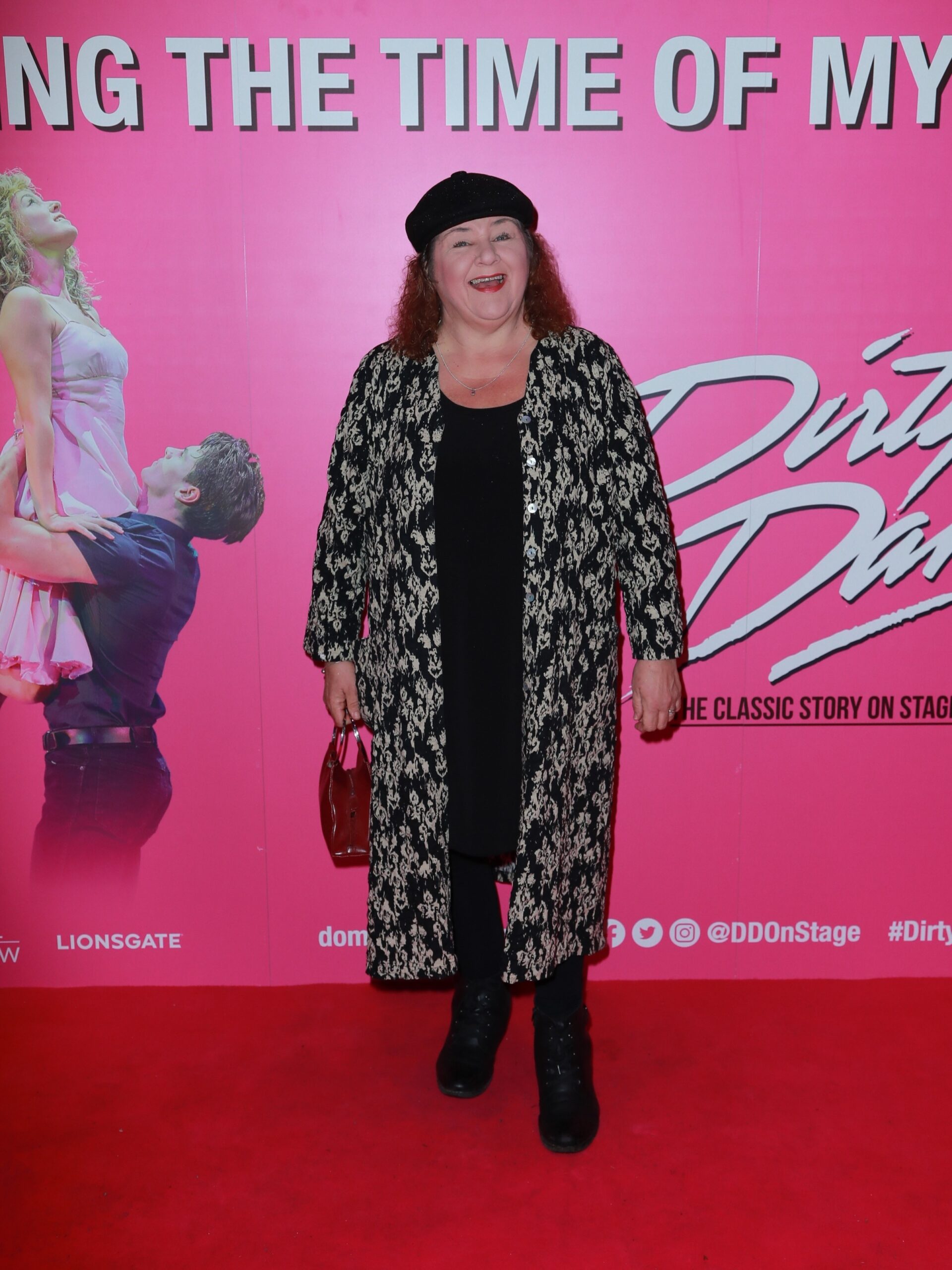 EastEnders star Cheryl Fergison smiling on red carpet at event