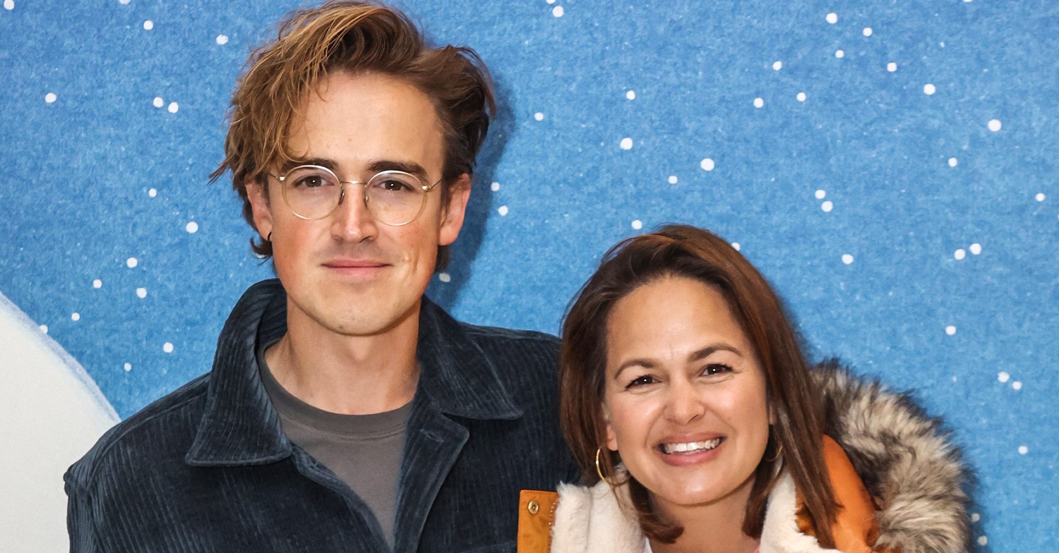 Tom and Giovanna Fletcher posing on a red carpet