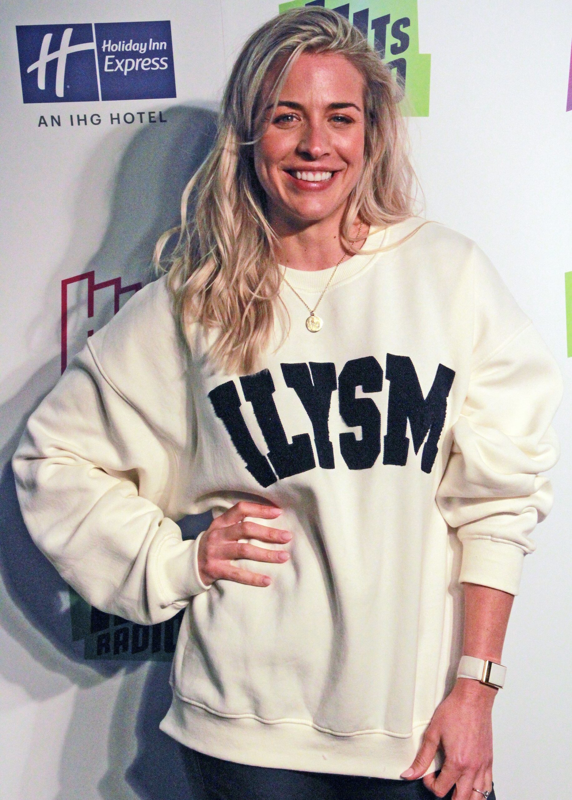 Gemma Atkinson smiling with her hand on her hip