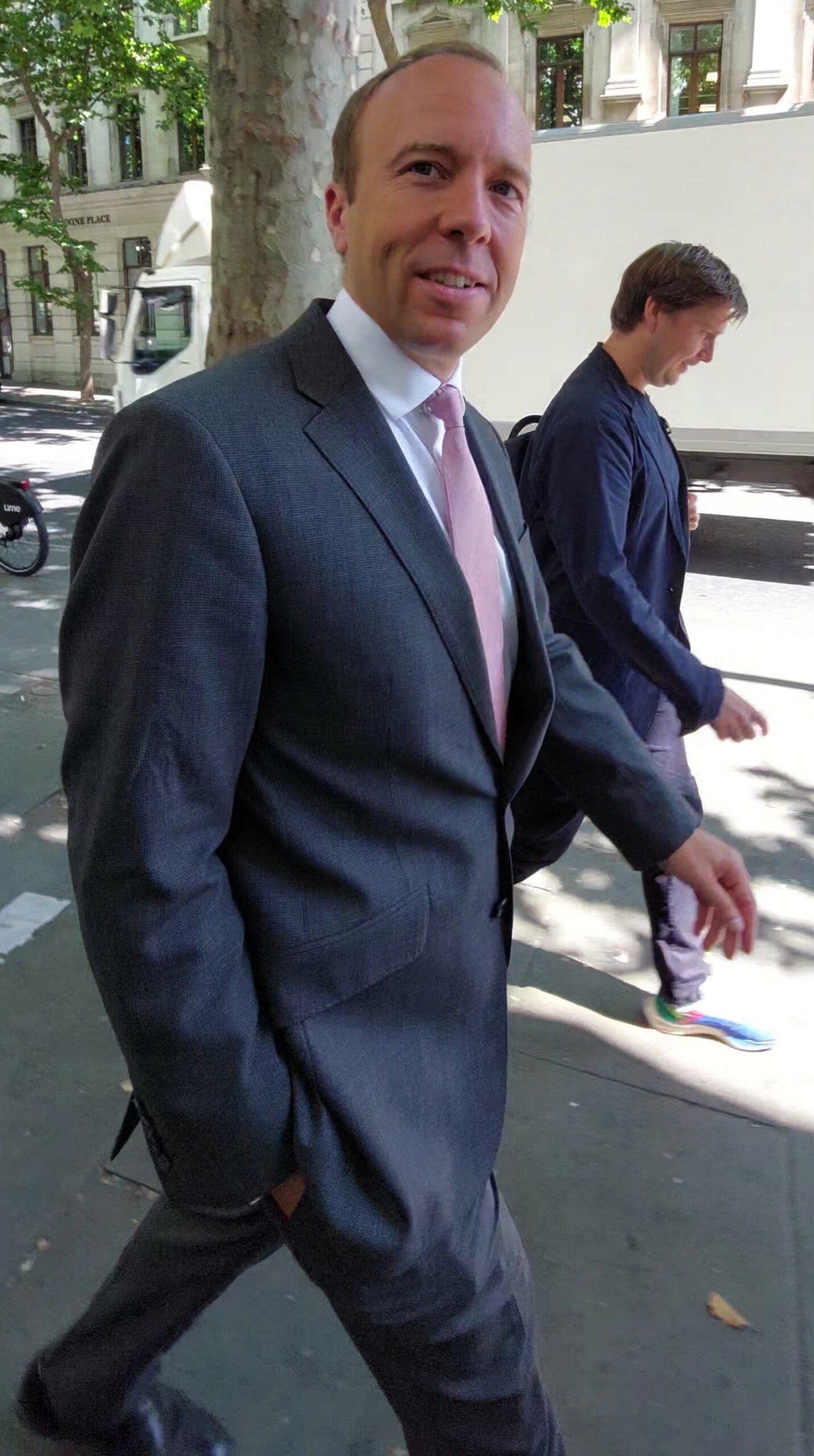 Matt Hancock in suit walking
