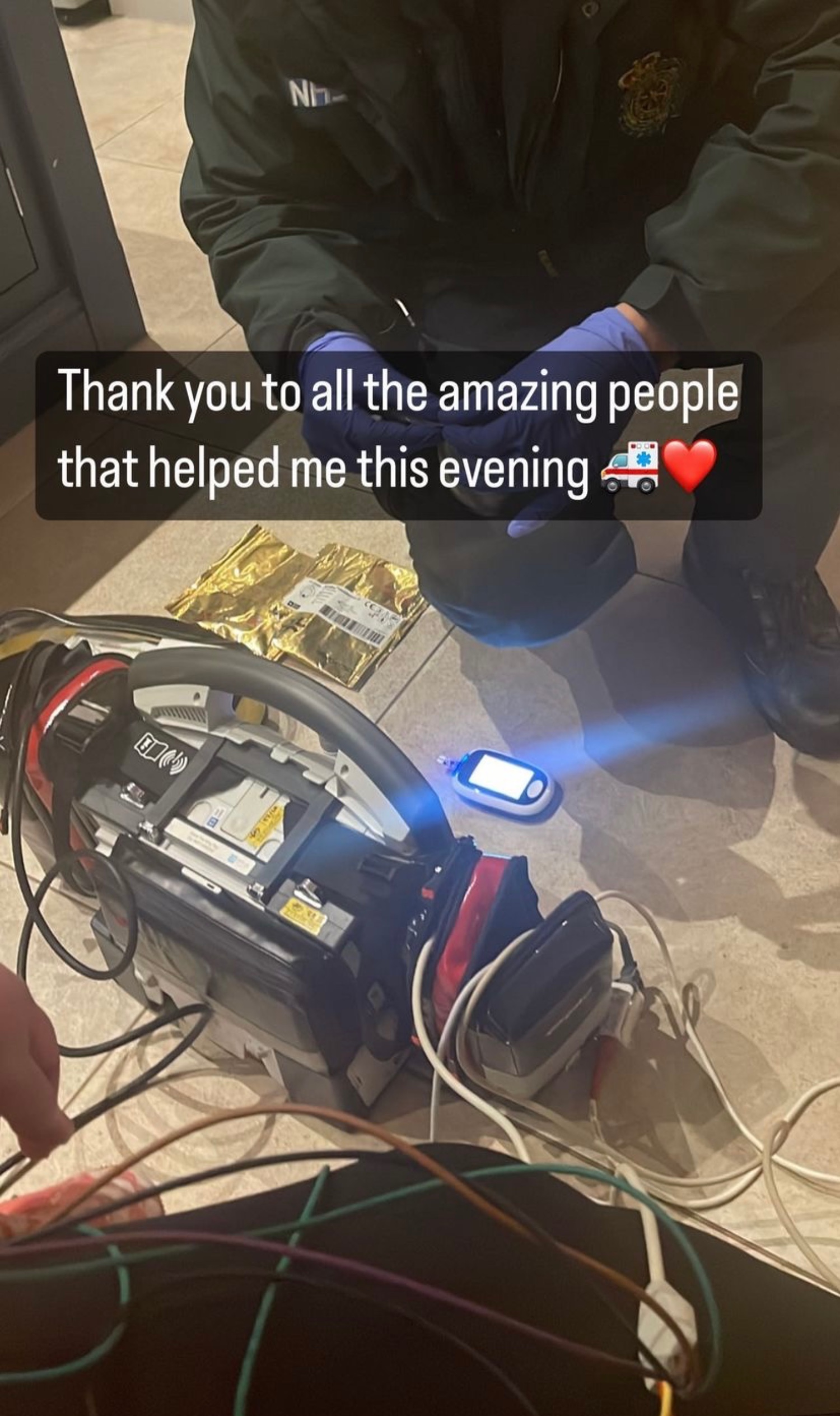 Paramedics tending to Gemma Collins in her home