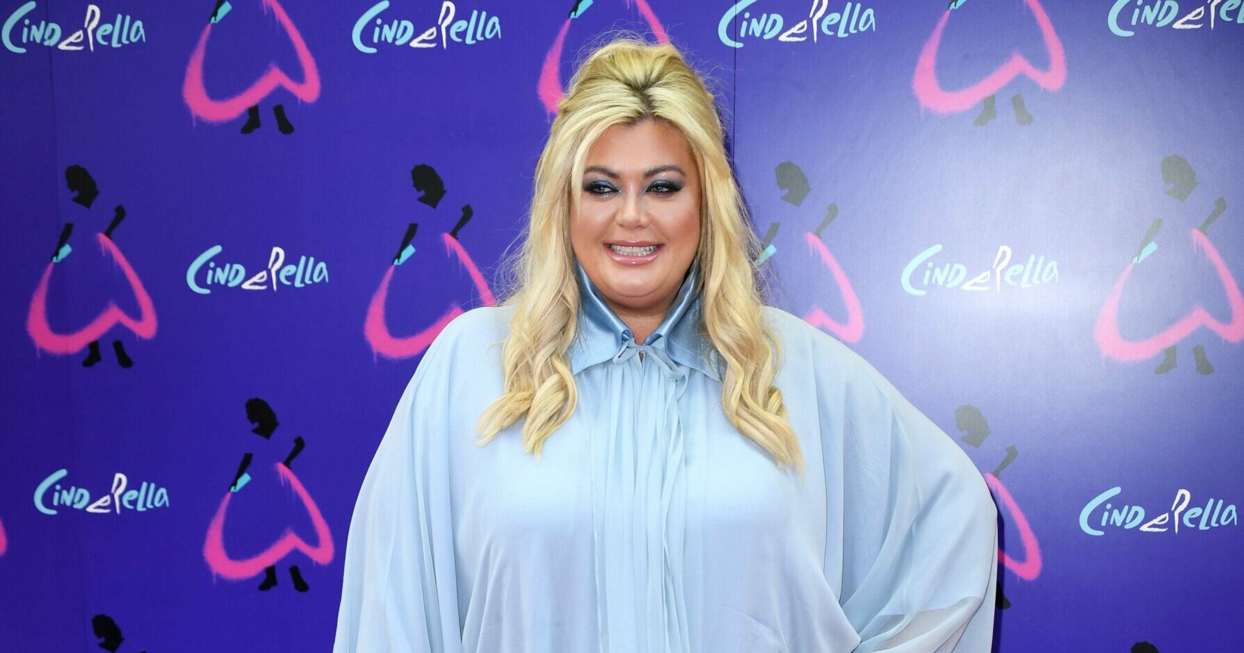 Gemma Collins wearing a blue shirt and smiling