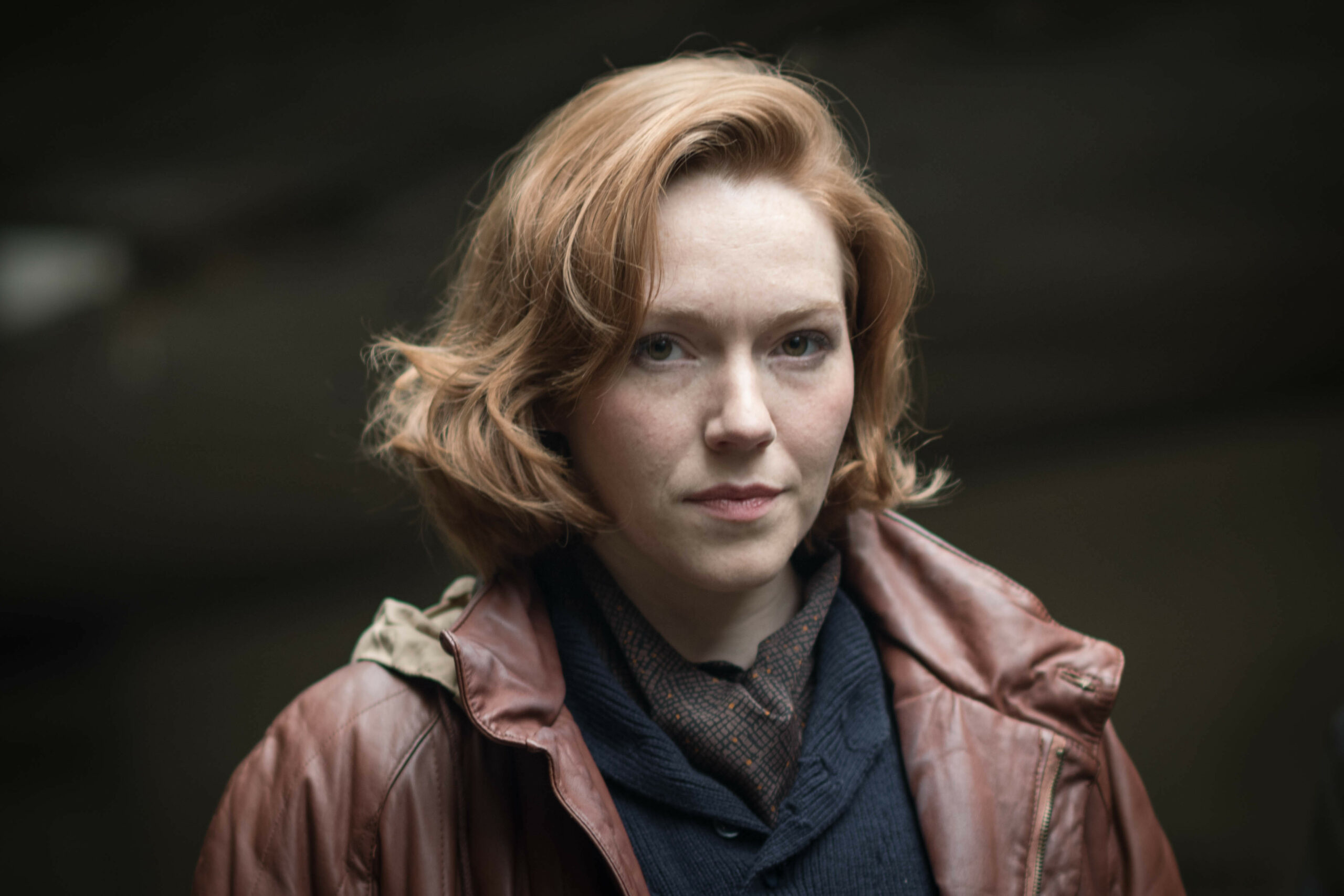 Nicki Jennings smirks in The Gold