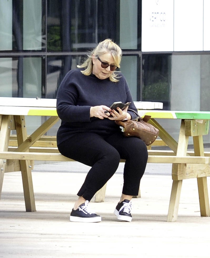 Fern Britton sitting on a bench