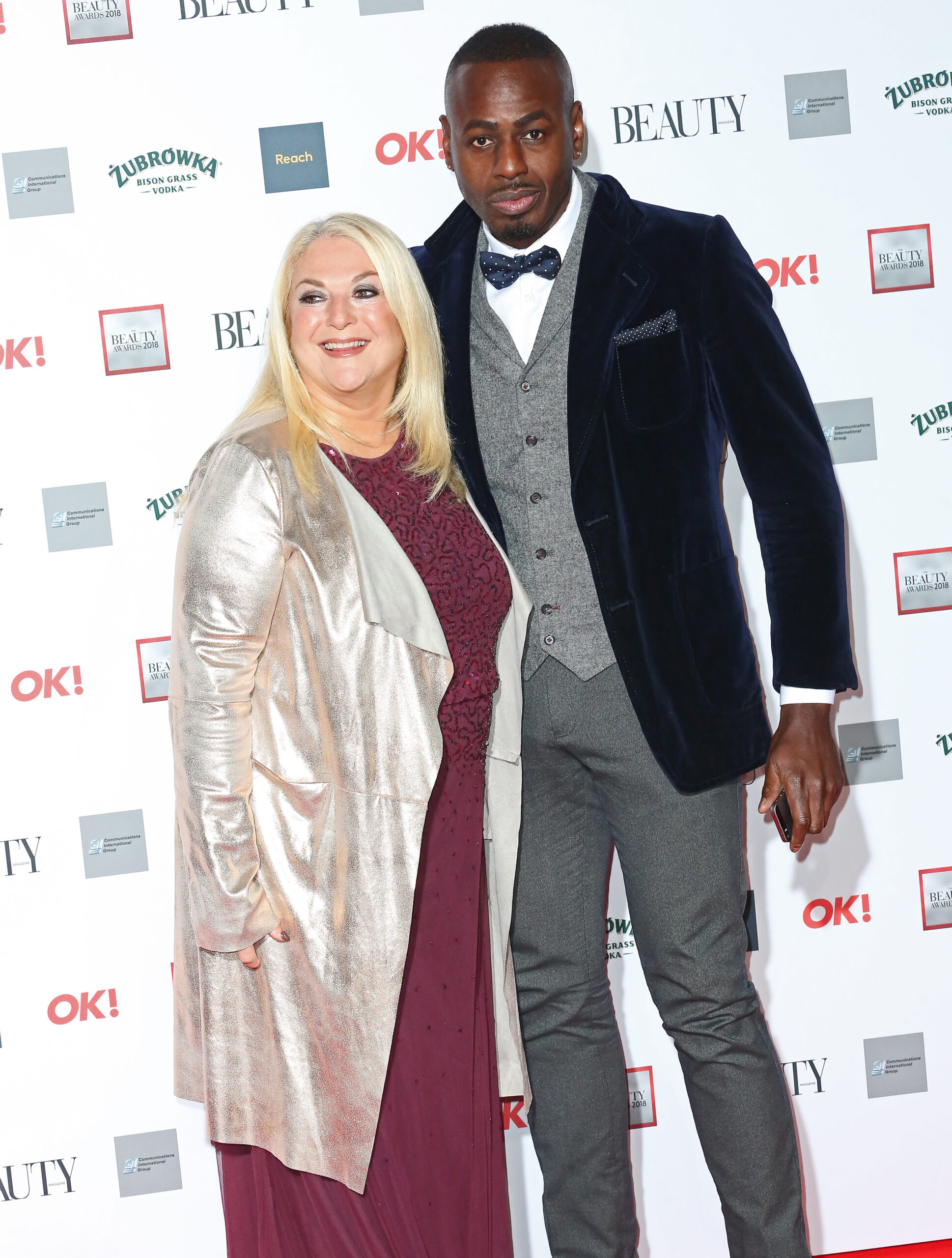 Vanessa Feltz and Ben Ofoedu standing together on the red carpet 