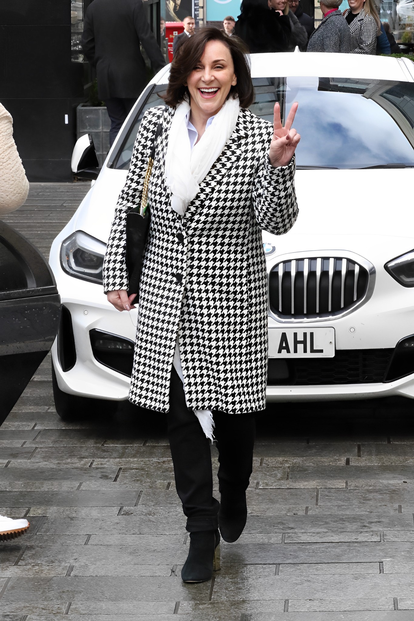 Shirley Ballas throws up a peace sign during the Strictly Come Dancing tour