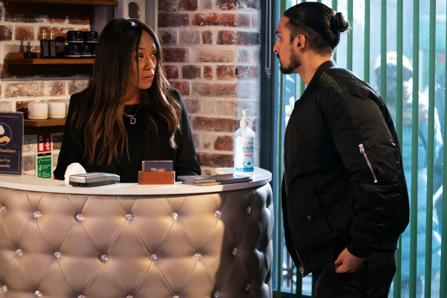 Ravi and Denise talking at the salon on EastEnders