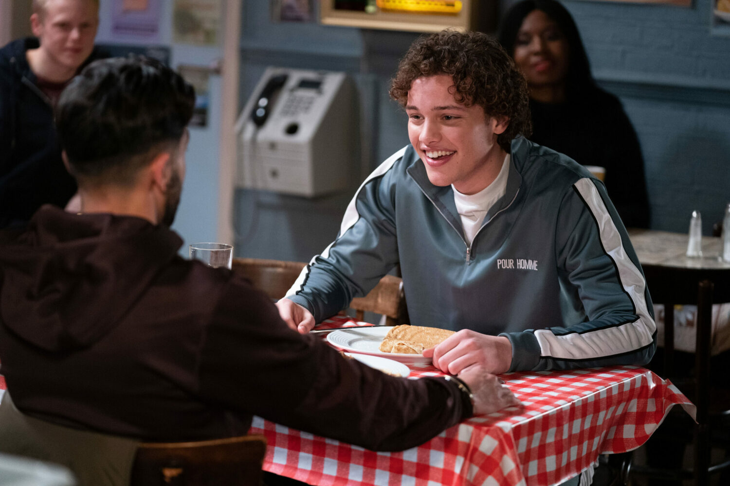 Freddie and Vinny grinning, eating pancakes in the cafe
