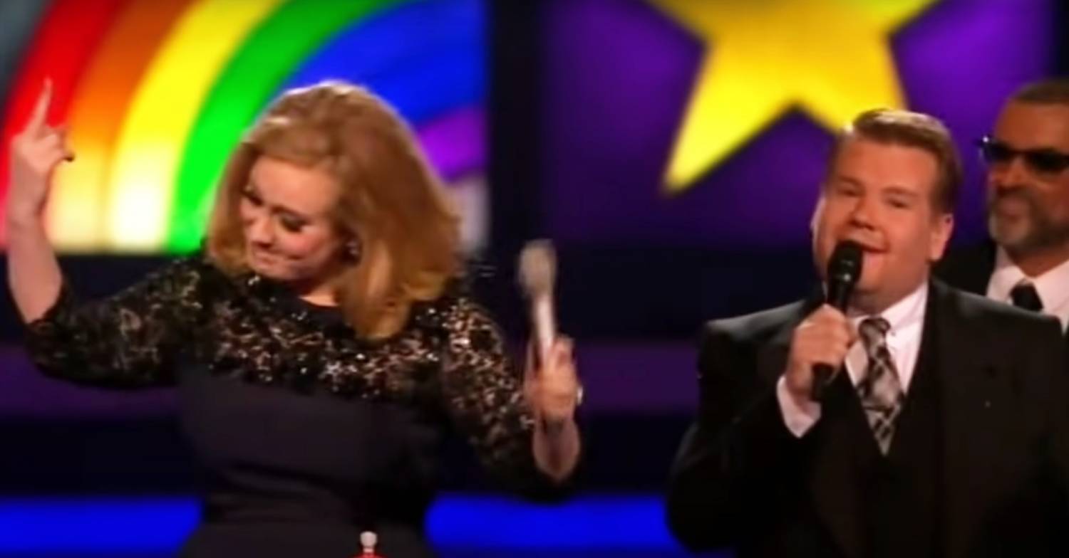 Adele raises her middle finger