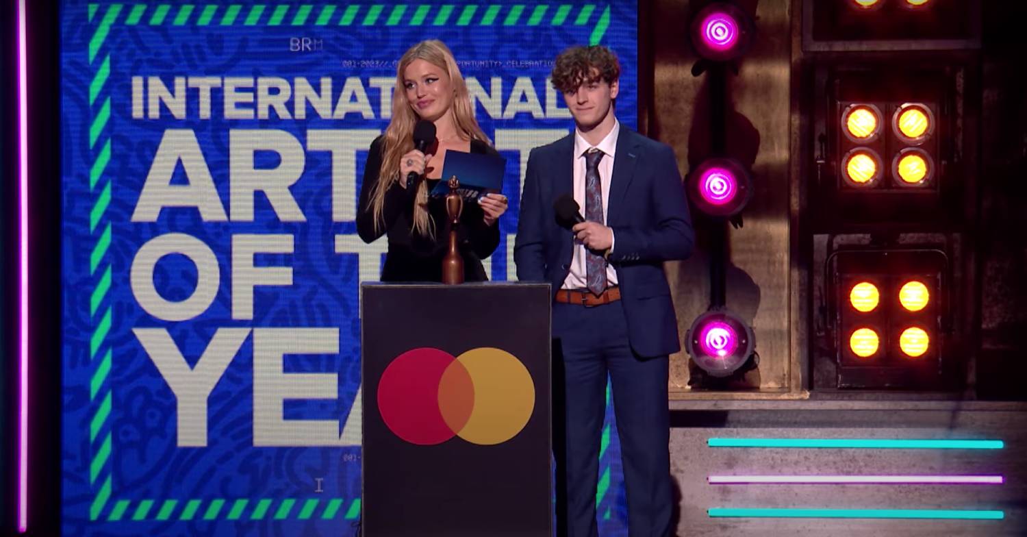 Georgia May Jagger stands next to Happy Valley star Rhys Connah at the BRIT Awards 2023