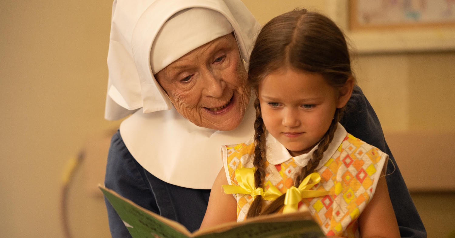 Sister Monica Joan reading a book to a little girl on BBC Call the Midwife