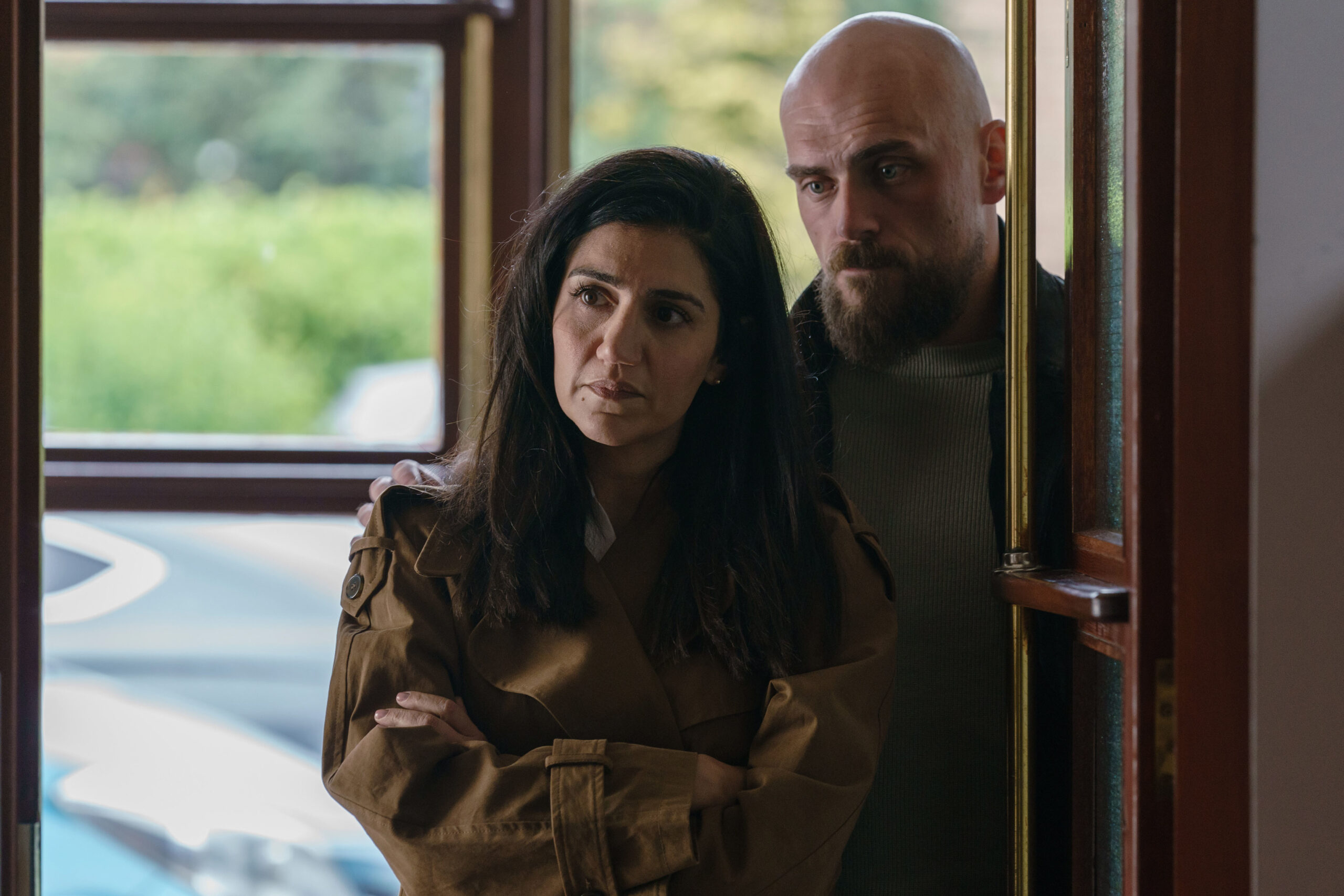 Leila Farzad and Samuel Edward-Cook standing in the doorway in Better