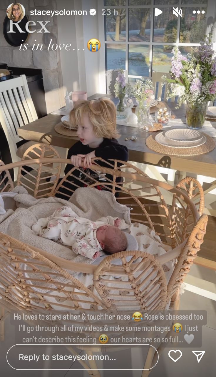 Stacey Solomon's son Rex looking at his little sister who's in a cot 