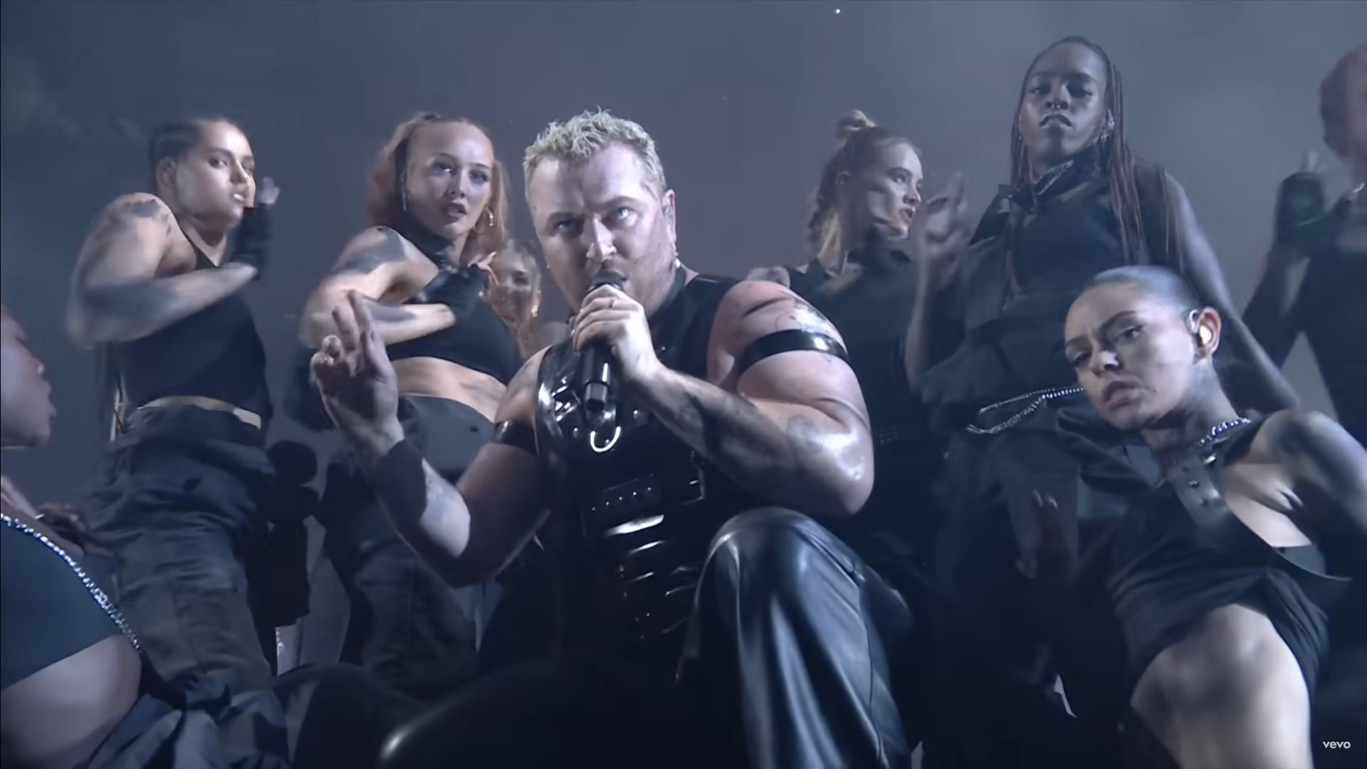 Sam Smith performs Unholy with back up dancers at the Brit Awards 2023